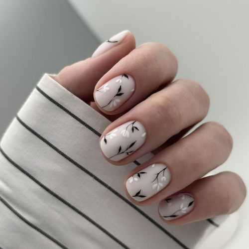White manicure with floral design