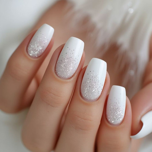 White manicure with glitter