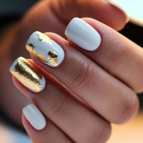 White manicure with gold foil
