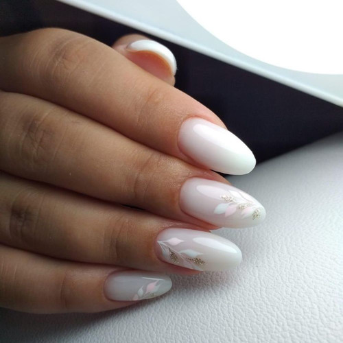 White manicure with delicate leaves